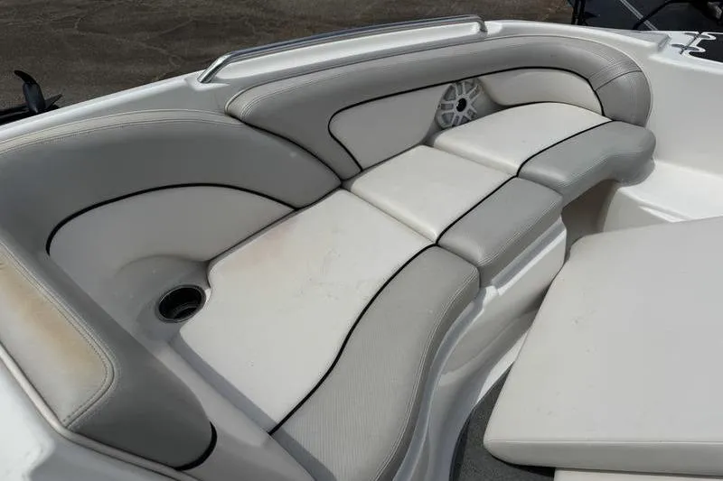 Slide: The Image of 2011 Yamaha Boats AR240 HO interior seating with gray and white upholstery. - 17