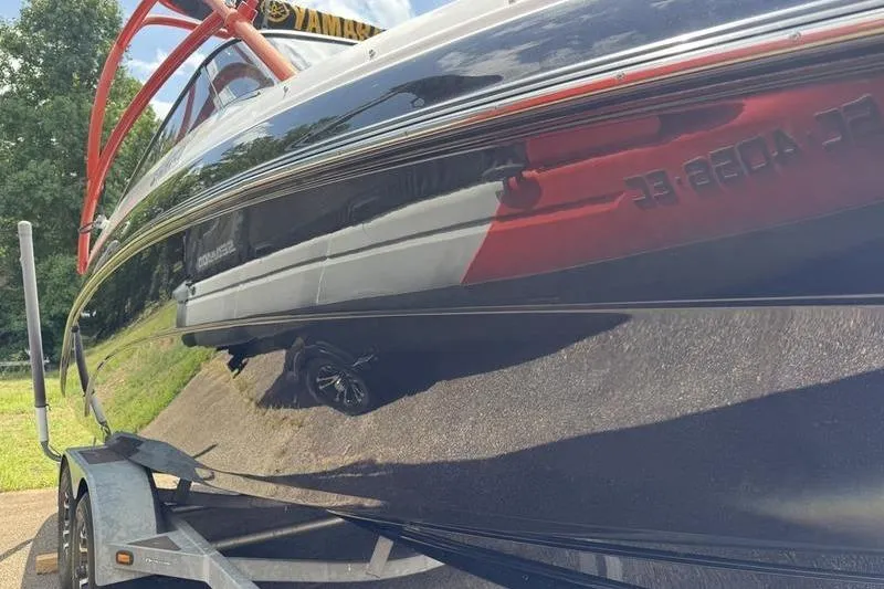 Slide: The Image of 2011 Yamaha Boats AR240 HO on trailer, reflecting surroundings. - 14
