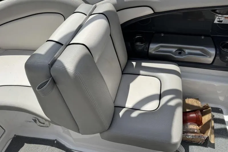 Slide: The Image of 2011 Yamaha Boats AR240 HO interior with gray seating and cup holders. - 7