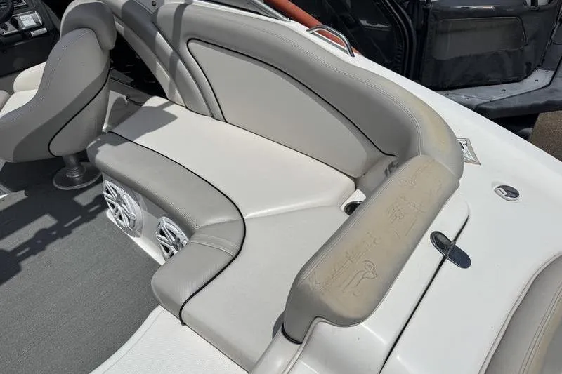 Slide: The Image of 2011 Yamaha Boats AR240 HO interior seating with gray upholstery and built-in speakers. - 16
