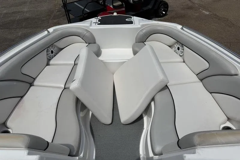 Slide: The Image of 2011 Yamaha Boats AR240 HO interior with gray and white cushioned seating. - 3