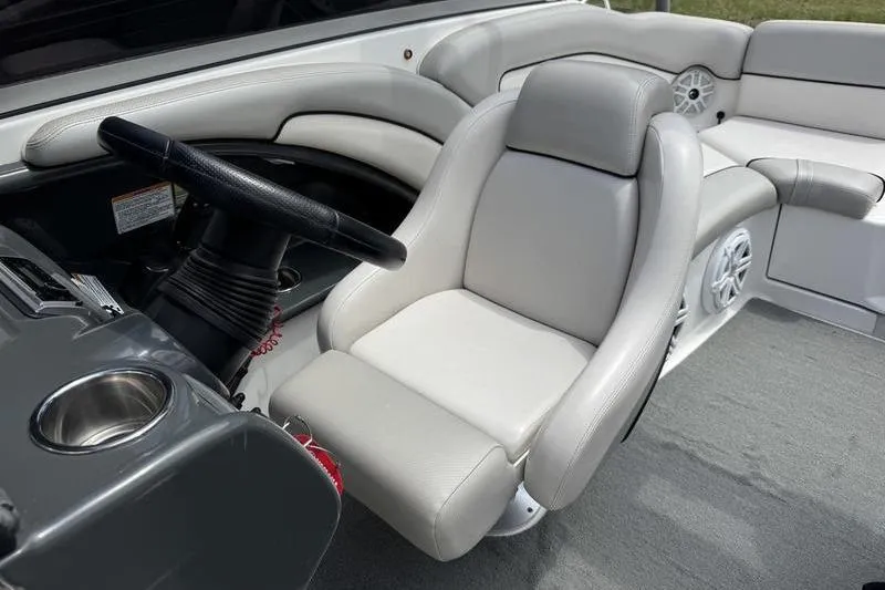 Slide: The Image of 2011 Yamaha Boats AR240 HO interior with steering wheel and plush seating. - 2