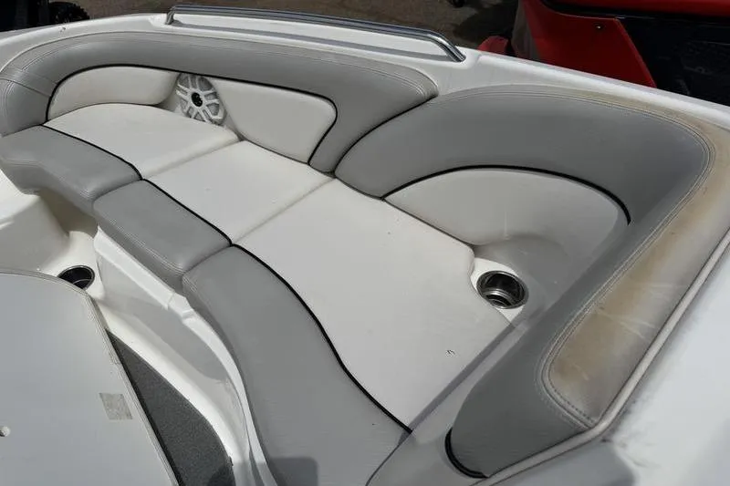 Slide: The Image of 2011 Yamaha Boats AR240 HO interior seating with gray and white upholstery. - 15