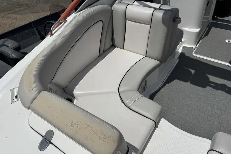 Slide: The Image of 2011 Yamaha Boats AR240 HO interior seating with light gray upholstery. - 6