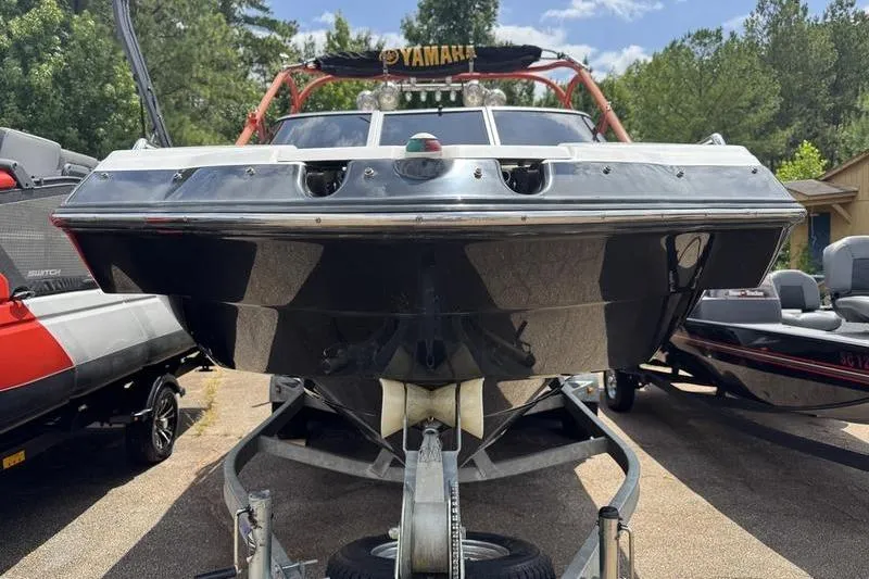 Slide: The Image of 2011 Yamaha Boats AR240 HO on trailer, front view, parked outdoors. - 9