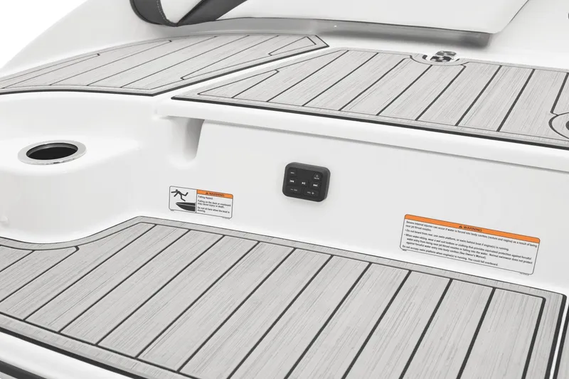 Slide: The Image of The image shows the stern of a 2024 Yamaha 195S boat with gray decking. - 39