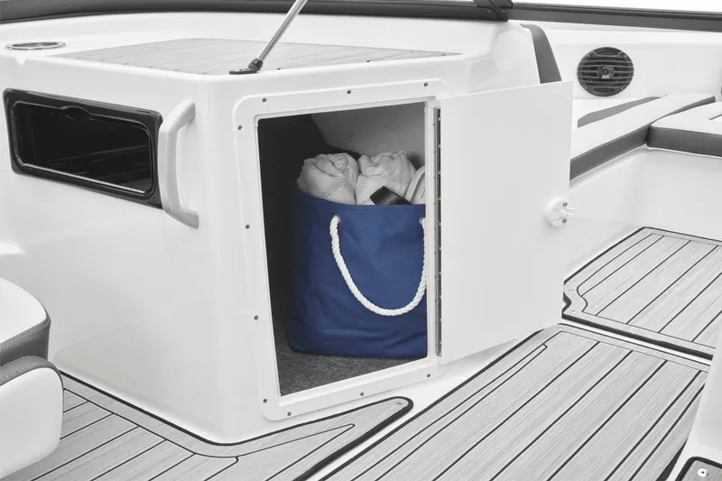 Slide: The Image of The 2024 Yamaha 195S features an open storage compartment with a blue bag inside. - 37