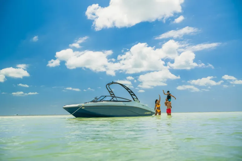 Slide: The Image of A 2024 Yamaha 195S in shallow water with three people enjoying themselves. - 27