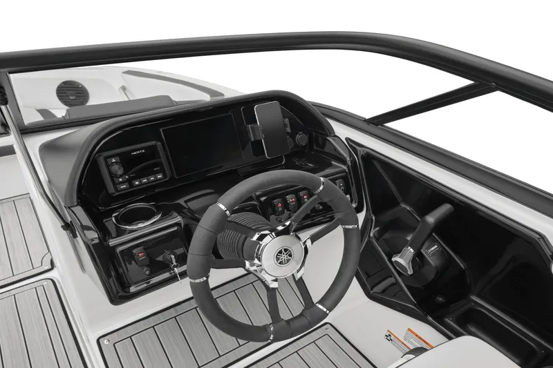 Slide: The Image of The image shows the cockpit of a 2024 Yamaha Boats 195S with a modern steering wheel and dashboard. - 28