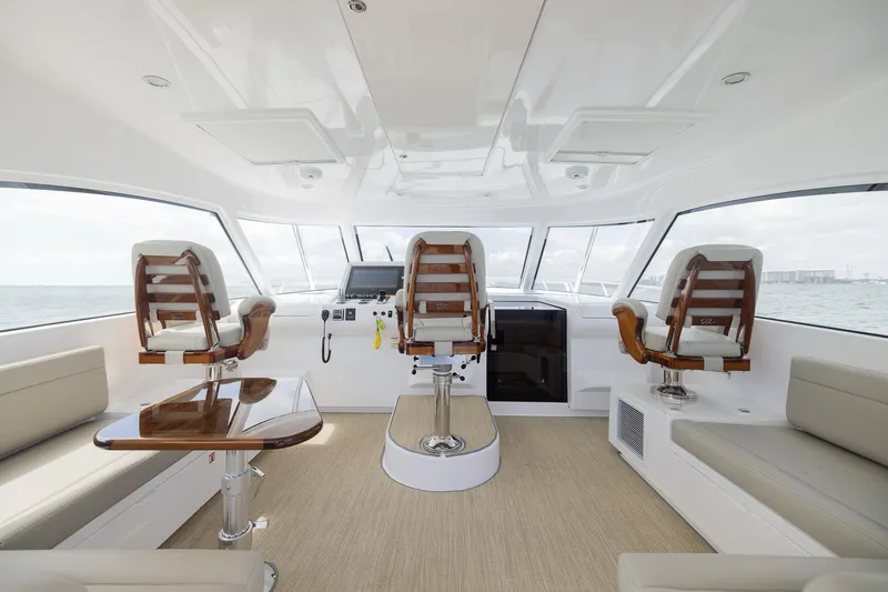 Slide: The Image of Interior of 2022 Bertram 50 Sport yacht with luxurious seating and modern helm. - 13