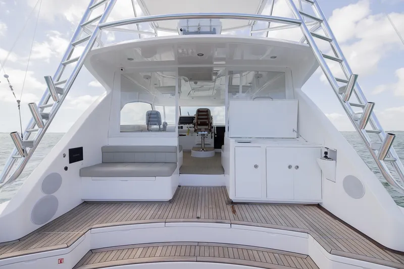 Slide: The Image of 2022 Bertram 50 Sport yacht deck with seating and cabinetry, ocean view. - 11