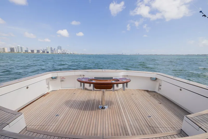 Slide: The Image of Bertram 50 Sport 2022 yacht deck with ocean and city skyline view. - 8