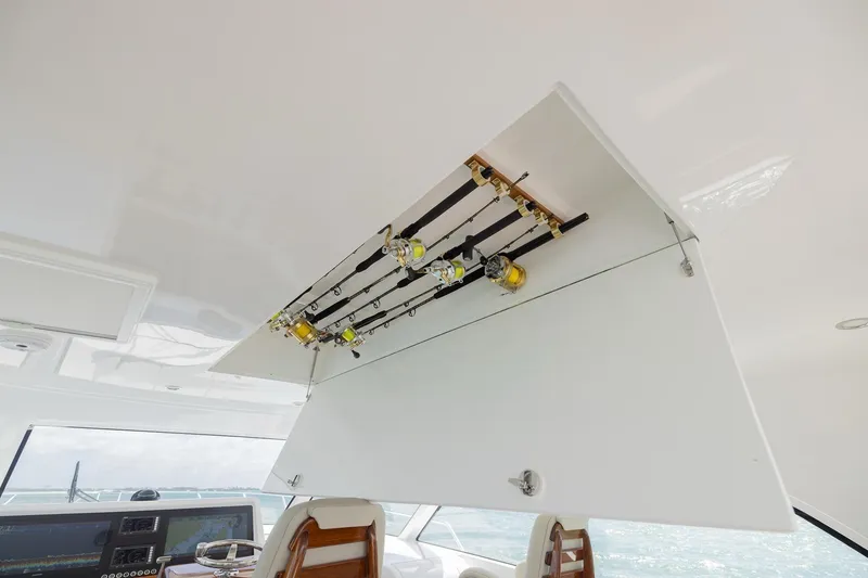 Slide: The Image of 2022 Bertram 50 Sport yacht interior with fishing rod storage. - 17