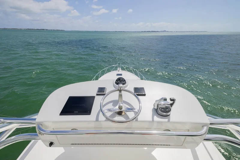 Slide: The Image of Helm of 2022 Bertram 50 Sport yacht with ocean view. - 4