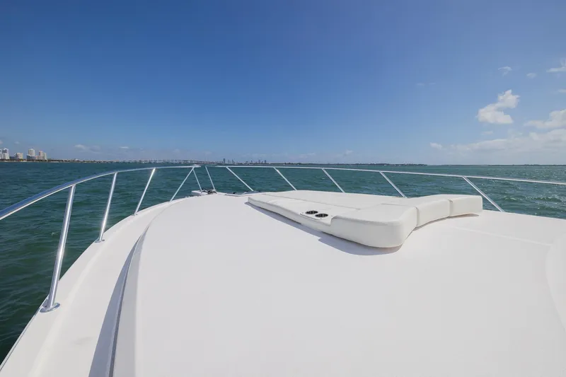Slide: The Image of 2022 Bertram 50 Sport yacht deck with ocean view and clear blue sky. - 7