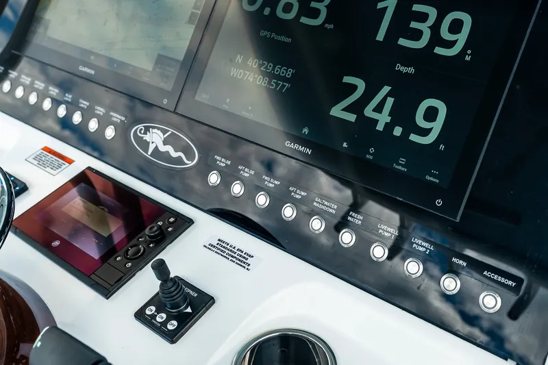Slide: The Image of Valhalla V-37 2027 dashboard with Garmin navigation and control panel. - 34