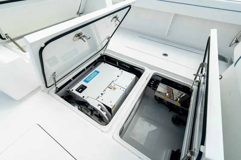 Slide: The Image of Open compartments on a 2027 Valhalla V-37 boat, revealing internal equipment. - 18