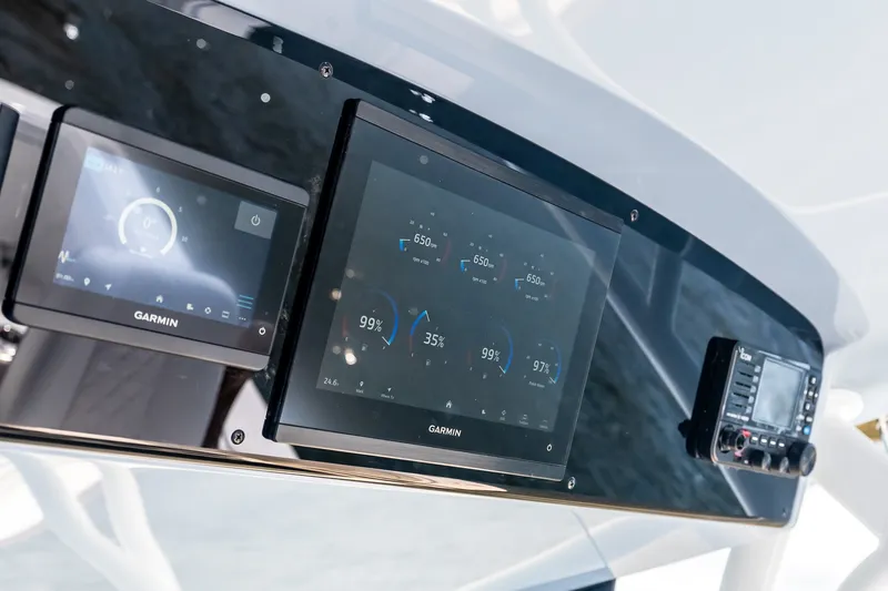 Slide: The Image of Valhalla V-37 2027 dashboard featuring Garmin navigation displays and controls. - 38