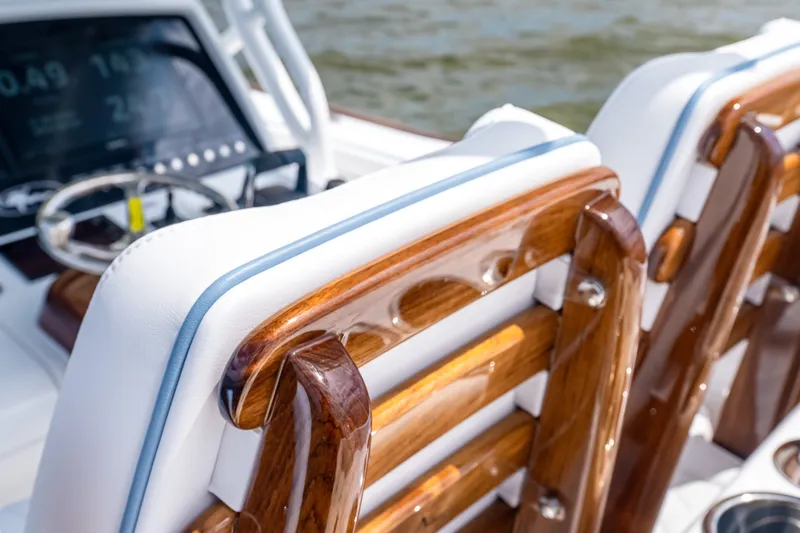 Slide: The Image of Luxury seating on 2027 Valhalla V-37 boat with polished wood and white upholstery. - 41