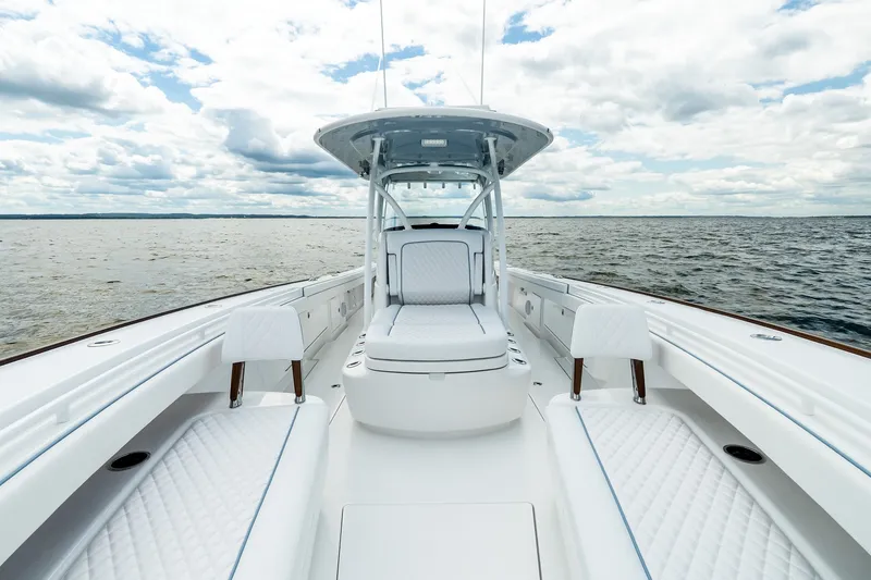 Slide: The Image of Luxurious 2027 Valhalla V-37 boat interior with white seating on open water. - 49