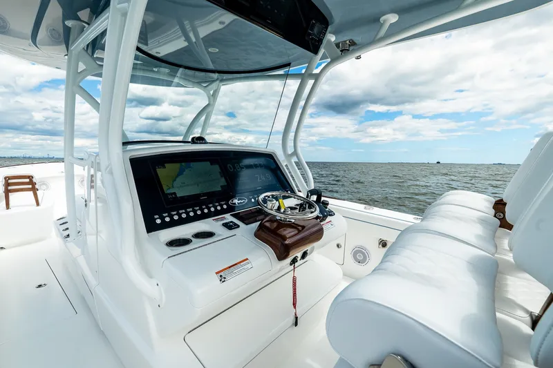 Slide: The Image of Valhalla V-37 2027 boat cockpit with advanced navigation system on open water. - 29