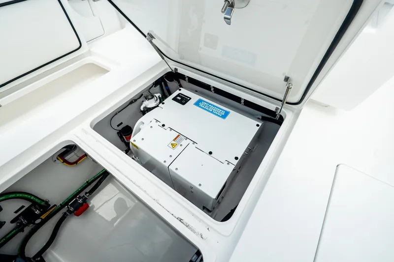 Slide: The Image of 2027 Valhalla V-37 boat compartment with electrical equipment and wiring. - 17
