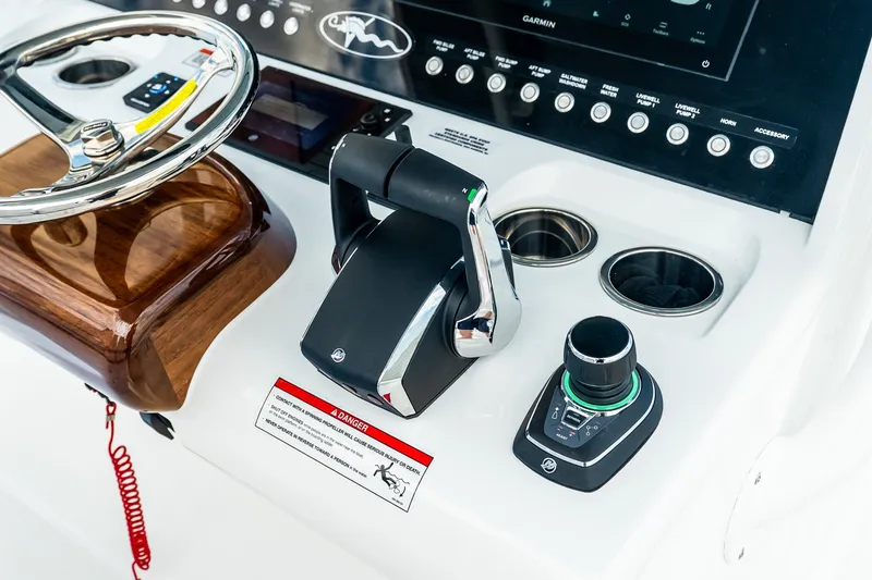 Slide: The Image of Valhalla V-37 2027 boat dashboard with steering wheel and control panel. - 33