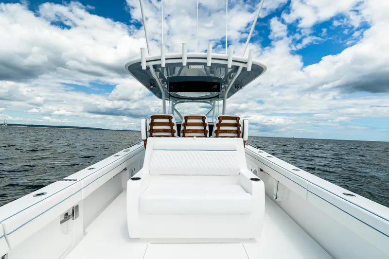 Slide: The Image of Valhalla V-37 2027 boat on open water under a partly cloudy sky. - 19