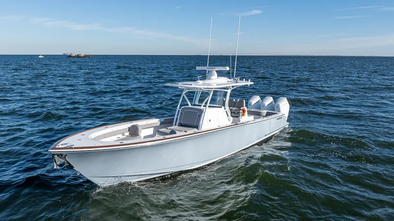 Slide: The Image of 2025 Valhalla Boatworks V-37 cruising on open water under clear skies. - 1