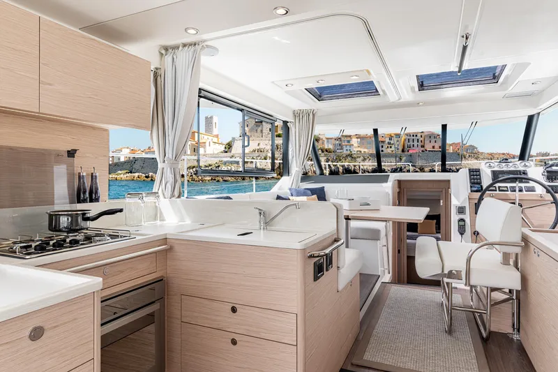Slide: The Image of Luxurious interior of 2026 Beneteau Swift Trawler 41 Fly with modern kitchen and scenic view. - 3