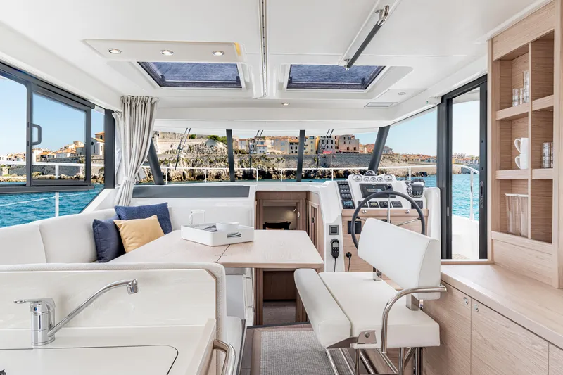Slide: The Image of Interior of 2026 Beneteau Swift Trawler 41 Fly, featuring modern helm and seating area. - 4