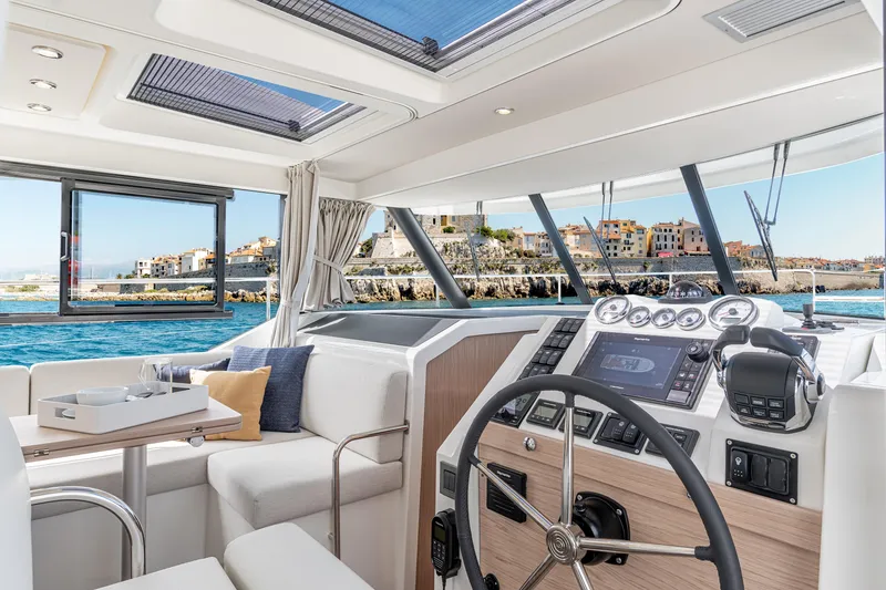Slide: The Image of Interior of 2026 Beneteau Swift Trawler 41 Fly, featuring modern helm and scenic ocean view. - 19