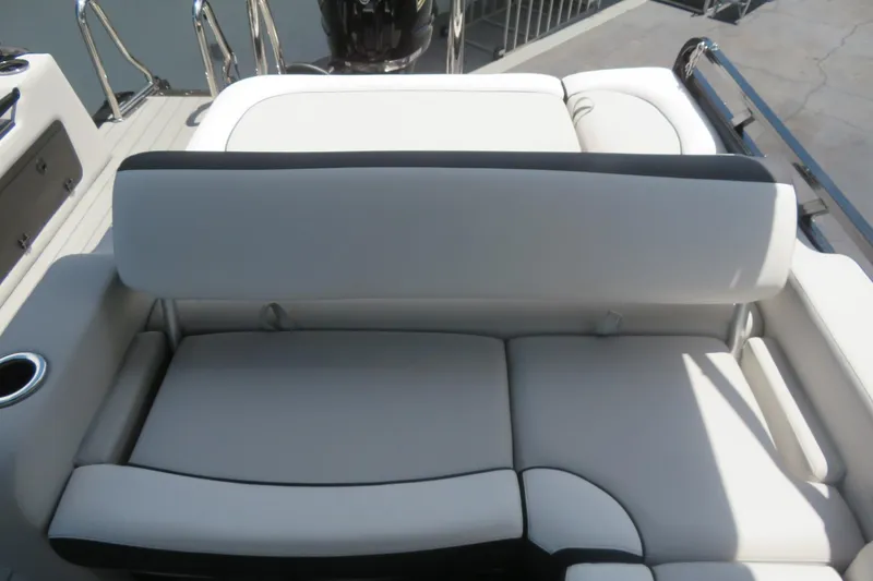 Slide: The Image of 2027 Avalon LSZ Versatile Rear Bench, 25-foot boat seating with cup holder, gray upholstery. - 19