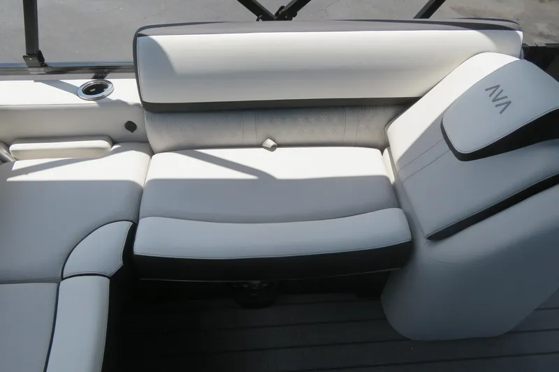 Slide: The Image of 2027 Avalon LSZ Versatile Rear Bench, luxurious white seating with black accents on a boat. - 20
