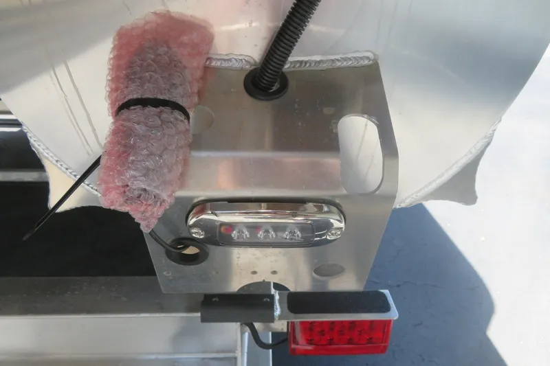Slide: The Image of Close-up of 2027 Avalon LSZ Versatile Rear Bench boat detail with bubble wrap and wiring. - 9
