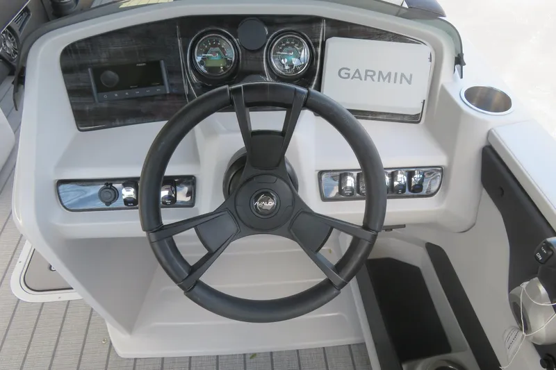 Slide: The Image of Steering console of 2027 Avalon LSZ Versatile Rear Bench boat with Garmin display. - 37