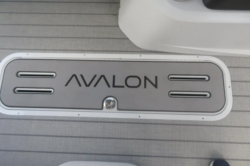 Slide: The Image of 2027 Avalon LSZ Versatile Rear Bench, 25-foot boat deck with logo. - 33