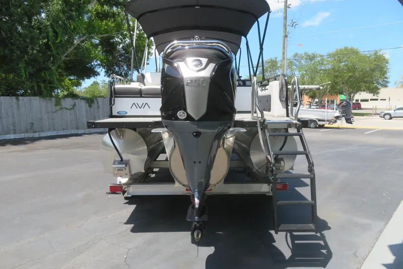 Slide: The Image of 2027 Avalon LSZ Versatile Rear Bench boat with powerful outboard motor and ladder. - 3