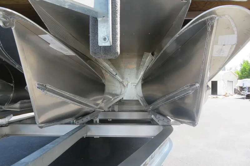 Slide: The Image of Underneath view of 2027 Avalon LSZ Versatile Rear Bench pontoon boat, showcasing aluminum structure. - 13
