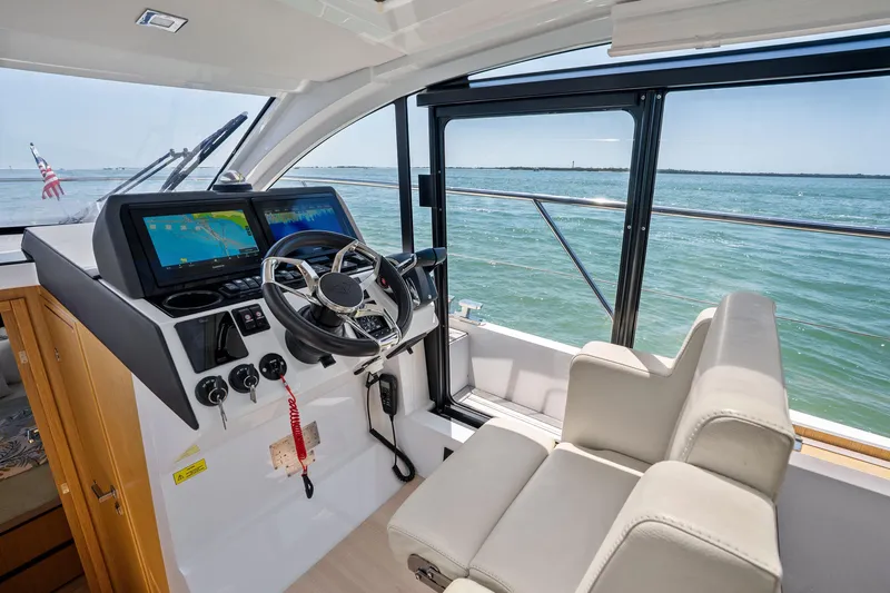 Slide: The Image of Interior view of 2023 Sealine C335V yacht cockpit with modern navigation system. - 15