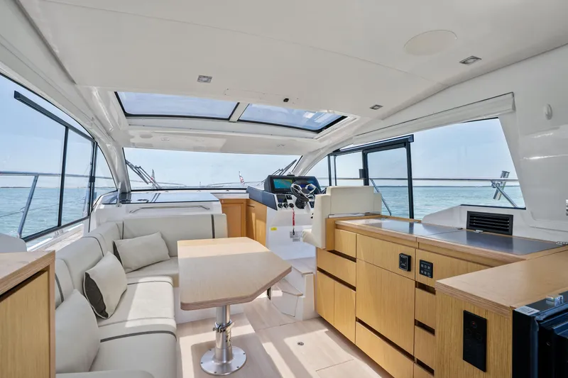 Slide: The Image of Luxurious interior of 2023 Sealine C335V yacht with modern furnishings and panoramic windows. - 12