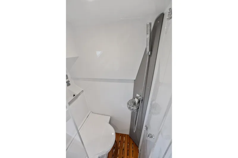 Slide: The Image of 2023 Sealine C335V yacht bathroom with modern fixtures and wooden flooring. - 22