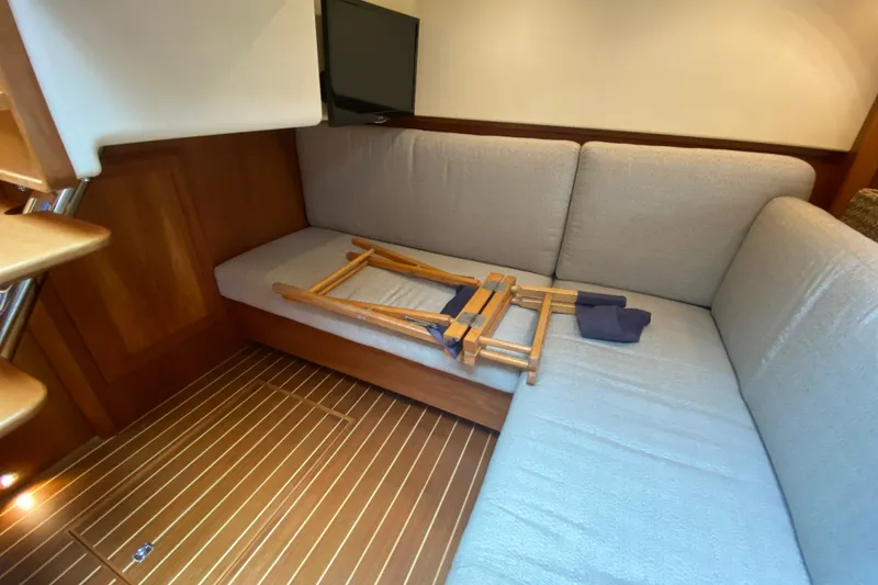 Slide: The Image of Interior of 2014 Sabre 38 Salon Express with cozy seating and wooden flooring. - 23