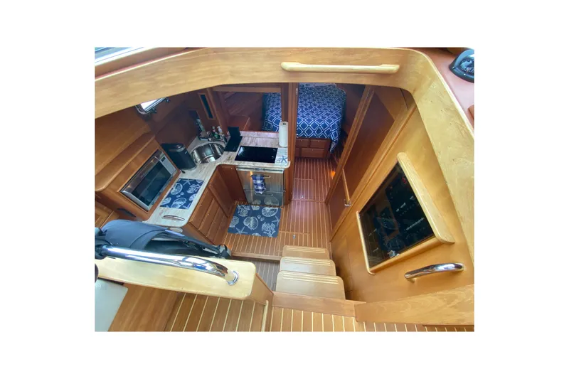 Slide: The Image of Interior view of 2014 Sabre 38 Salon Express yacht, featuring kitchen and sleeping area. - 16