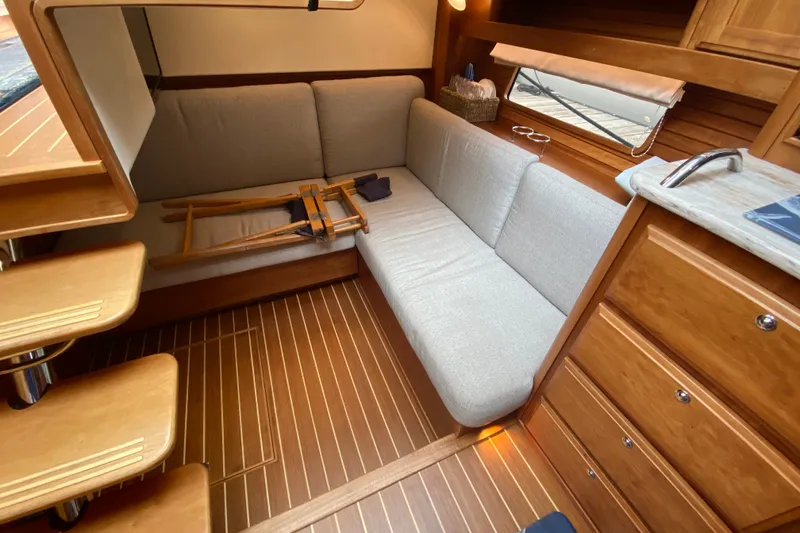 Slide: The Image of Interior of 2014 Sabre 38 Salon Express with wooden flooring and cozy seating area. - 22