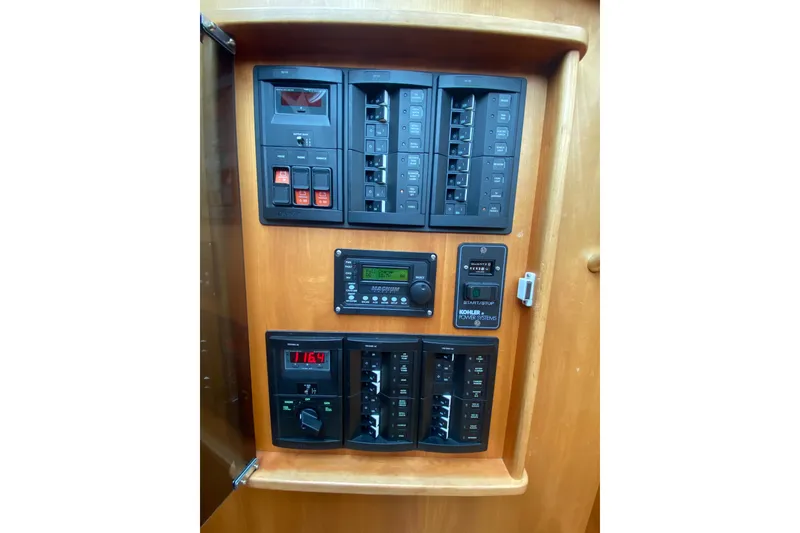 Slide: The Image of Electrical panel on 2014 Sabre 38 Salon Express yacht, featuring switches and controls. - 26