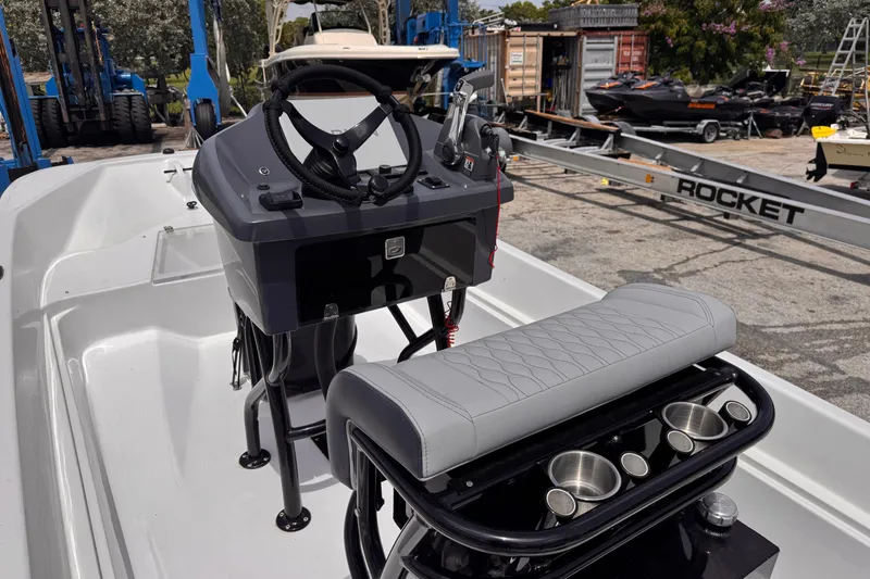 Slide: The Image of 1980 Boston Whaler 17 Montauk boat interior with steering console and seating. - 5