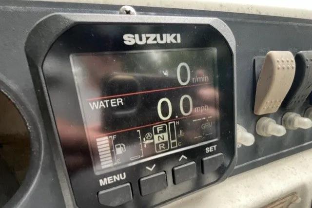 Slide: The Image of Suzuki display on 2004 Boston Whaler 220 Dauntless showing speed and RPM. - 14