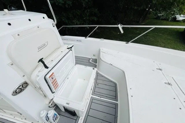Slide: The Image of 2004 Boston Whaler 220 Dauntless boat interior with open storage compartment. - 4