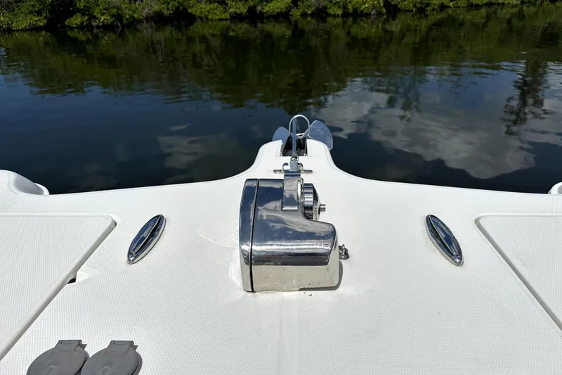 Slide: The Image of Bow view of 2022 World Cat 325 CC boat with water reflection. - 11